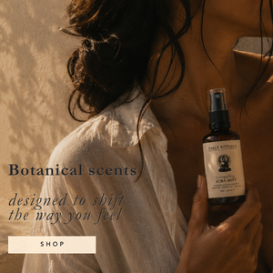 A woman in a white blouse holds a dark amber spray bottle labeled Jack Skellington Botanical Scents against a warm beige background with overlaid text reading 'Botanical scents designed to shift the way you feel' and a 'SHOP' button.
